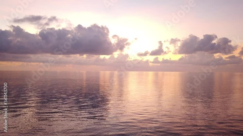 Cinematic 4K Tilt Up of Sunset on Waves of Indian Ocean in Bay of Bengal, Andaman Islands, India. photo