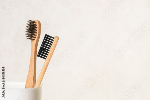 Eco bathroom accessories  rejection of plastic and zero waste concept. Wooden toothbrushes closeup on a white background. Copy space. 