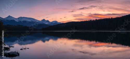 Patricia lake with mountain range reflection colorful sky at sunset at Jasper national park © Mumemories