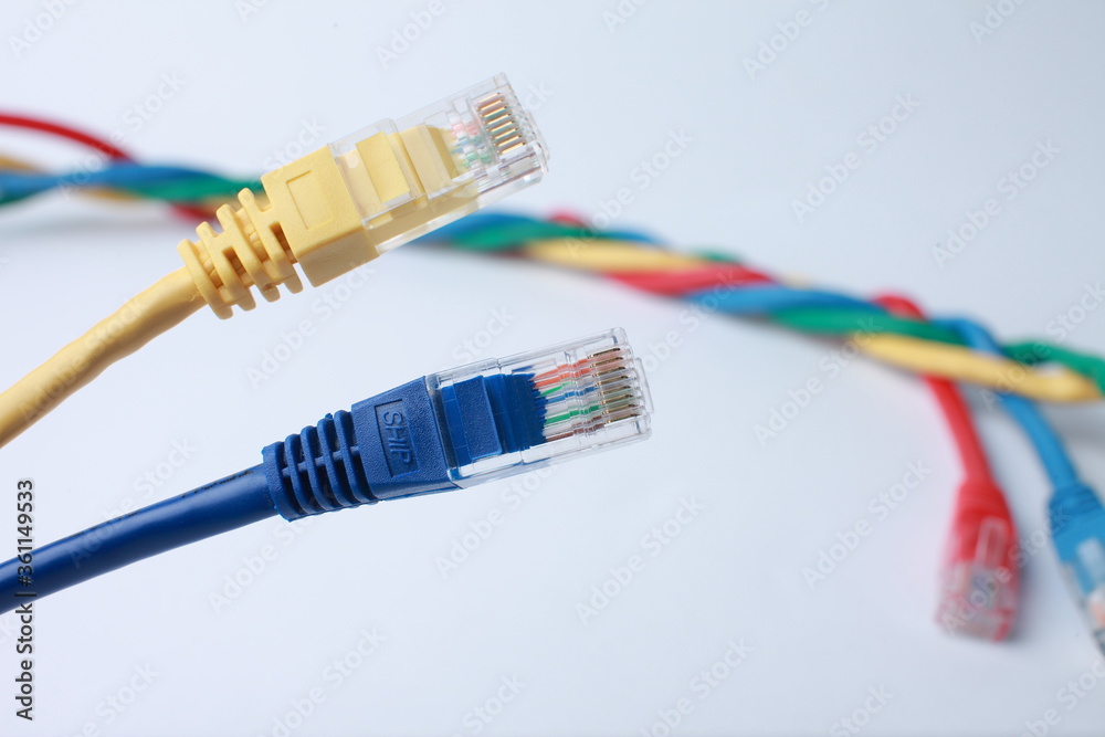 Network Ethernet Cables. Network switch with optical and ethernet connected wires. Network Ethernet Cables. Network switch with optical and ethernet connected wires.