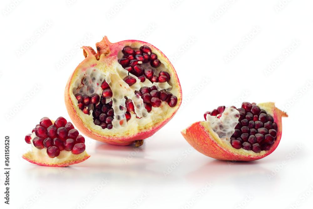 Juicy pomegranate fruit isolated on white background Juicy pomegranate fruit isolated on white background