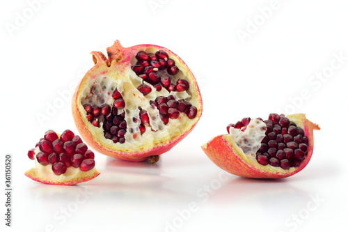 Juicy pomegranate fruit isolated on white background