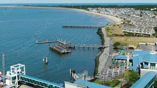 Lewes Delaware ferry passenger terminal and Cape Henlopen State Park, aerial tilt up photo