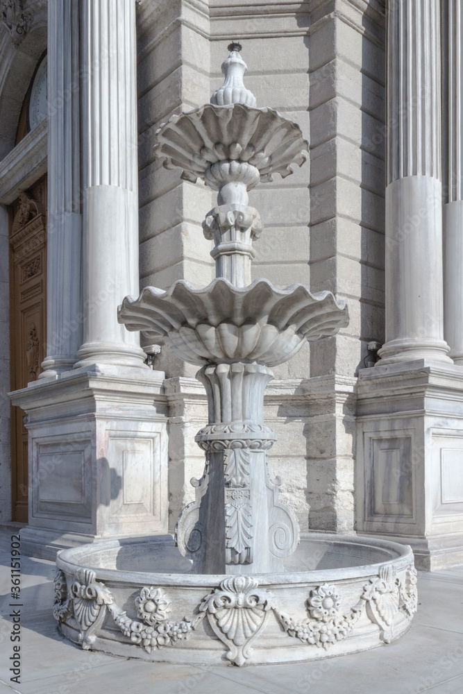 Antique marble fountain near the Clock Tower. Is situated outside Dolmabahce Palace in Istanbul, Turkey. Built in 1895