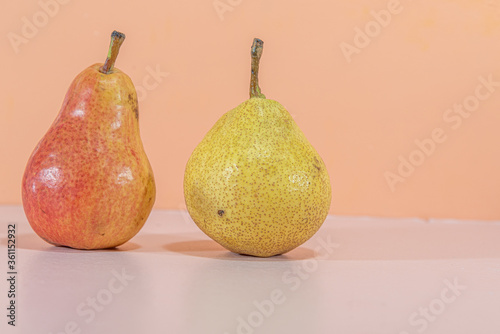 Fresh fruits of P  ra Park  Pyrus spp.  On orange background.NEF