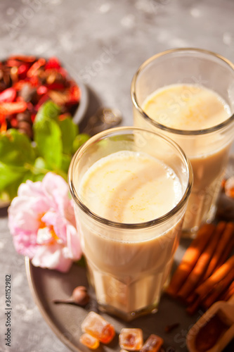 masala tea chai with milk and spices. © zulfiska