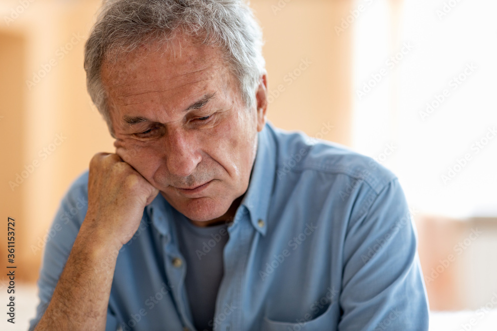 Senior man lost in thought 
