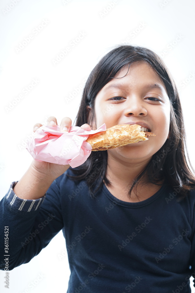 Young Girl eating kebab or shawarma Young Girl eating kebab or shawarma