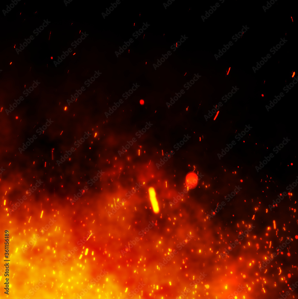 fire sparks over black background. Fire sparks background. Abstract dark glitter fire particle lights.	
