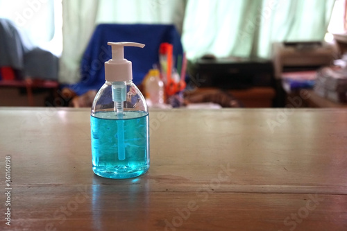 Hand sanitizer gel for hand hygiene corona virus protection placed on the desk in the office. 