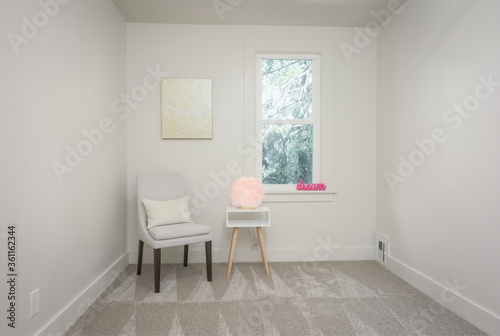 empty room with window and chair