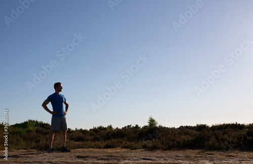 Man standing after fitness looking at view