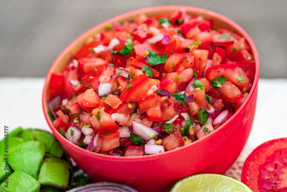 Tomato Salad mixed with red onion Mexican food homemade authentic style made from fresh healthy organic ingredient for vegan appetizer Tomato Salad mixed with red onion Mexican food homemade authentic style made from fresh healthy organic ingredient for vegan appetizer