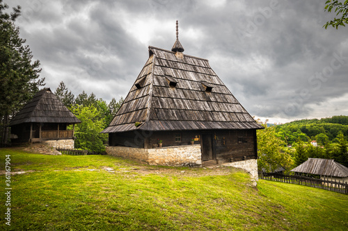 Old wooden rustic idyllic houses in a Sirogojno village on Zlatibor mountain in Serbia. photo