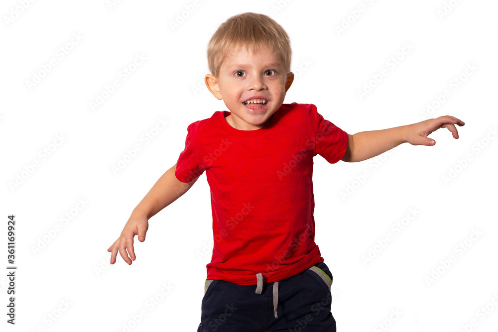 Happy little boy in red t-shirt jumping on white isolated background Happy little boy in red t-shirt jumping on white isolated background