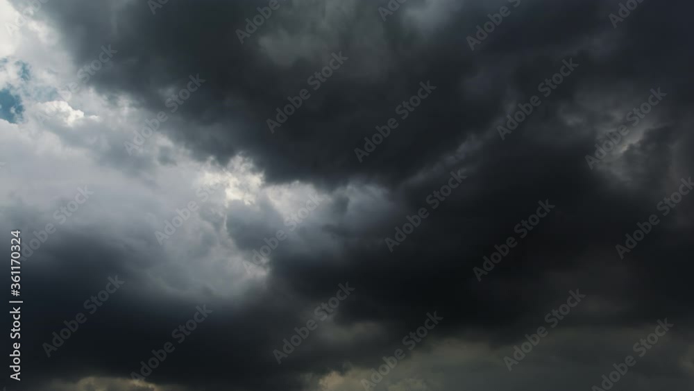 Picturesque timelapse of black stormy clouds moving heavily on the dark sky creating dangerous and dramatic atmosphere. Picturesque timelapse of black stormy clouds moving heavily on the dark sky creating dangerous and dramatic atmosphere.