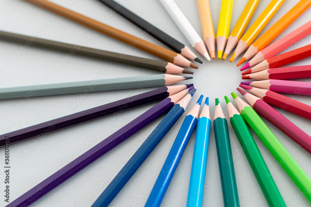 a close up on a set of coloured pencils set up in a circle 