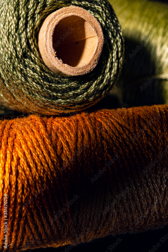 Three spools of yarn, closeup filling the frame Three spools of yarn, closeup filling the frame