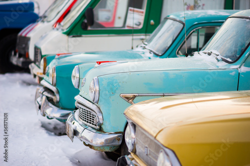 Different classic retro cars in a row
