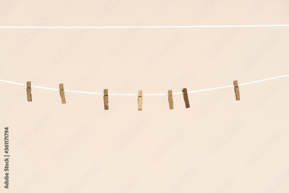 A clothespin on an empty clothesline background. Laundry. A clothespin on an empty clothesline background. Laundry.