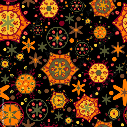 Bright, contrast, abstract pattern. Seamless vector with different orange, yellow and green elements on a black background. Items scattered randomly. For textiles, fashion prints, furniture upholstery