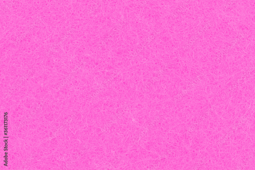 Fototapeta premium Bright pink felt textured fabric closeup background