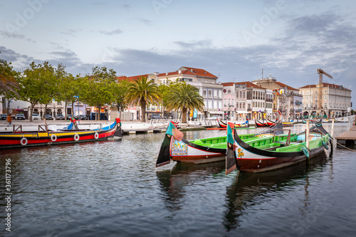 Colorful Moliceiro boat rides in Aveiro are popular with tourists to enjoy views of the charming canals.