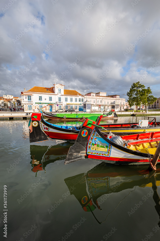 Colorful Moliceiro boat rides in Aveiro are popular with tourists to enjoy views of the charming canals.