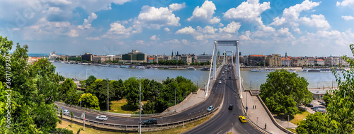 A panorama view across the Elizabeth  Bridge over the River Danube in Budapest showing the eastern shore during summertime photo