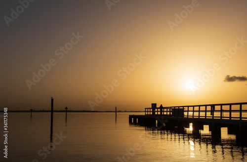 Friends on the dock at sunsrise