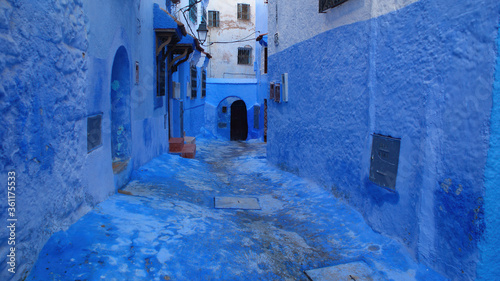 Beautiful Moroccan street in the blue medina of the city of Chefchaouen in Morocco with blue walls. © Amir Sutan 