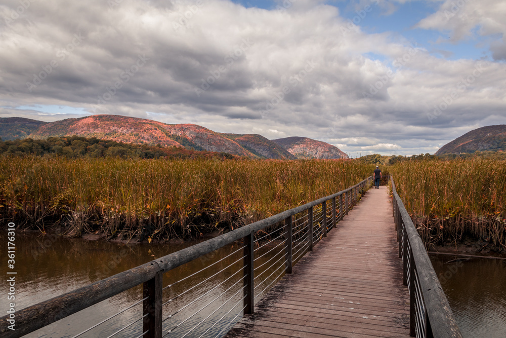 Constitution Marsh bridge along the Hudson River, NY, with early fall foliage