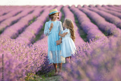 A child in lavender. Beautiful girl in a field with lavender.
