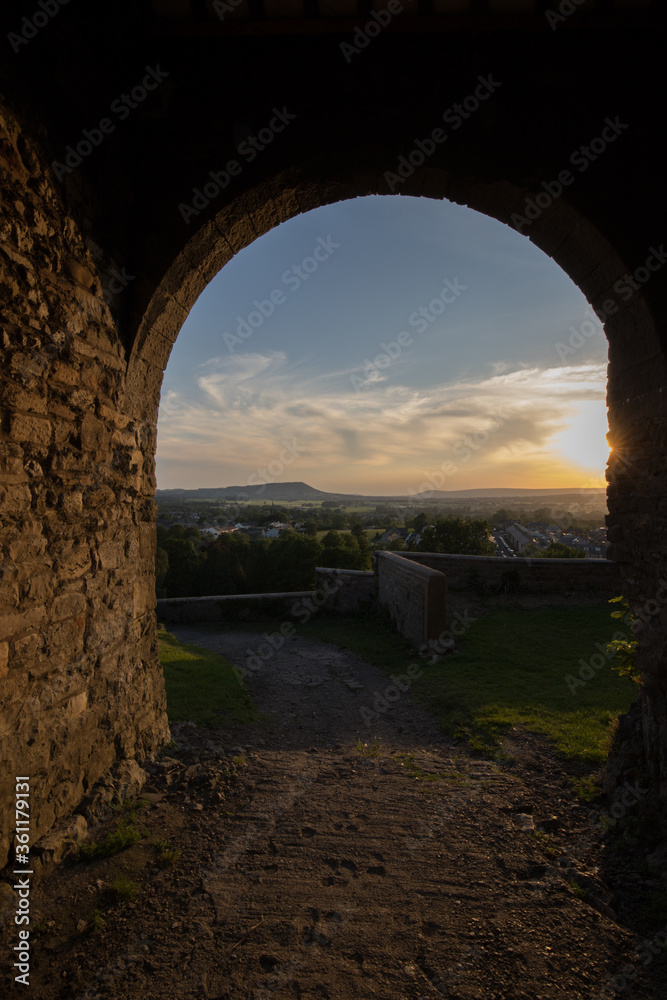 Viewpoint from Clitheroe castle looking through an archway down into the ribble valley