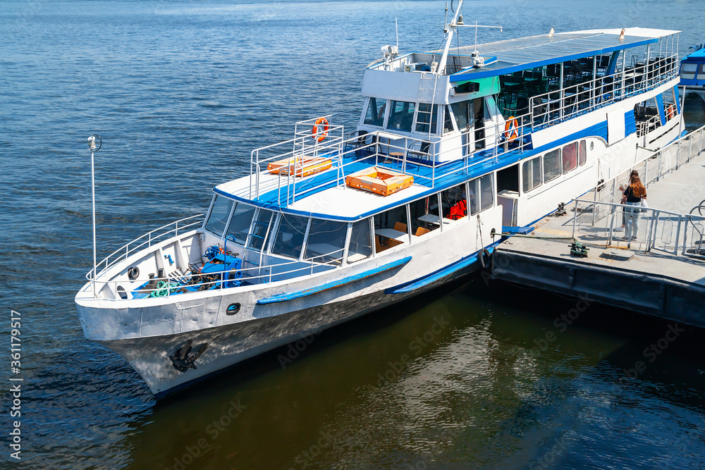 06/06/2020. Ukraine. Kiev. River pleasure boat moored to board passengers on deck. 06/06/2020. Ukraine. Kiev. River pleasure boat moored to board passengers on deck.