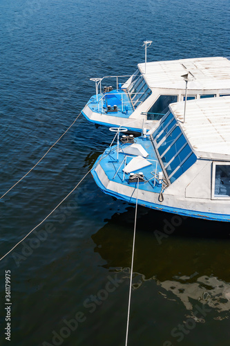 Deck two ships. Fragment of the deck of river pleasure boats. Water river transport.