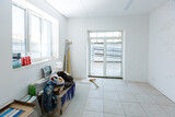 Unfinished apartment interior, repair in a white office room