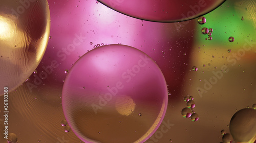 Macro structure of colorful oil bubbles. Chaotic motion. Abstract multicolored background. Pattern