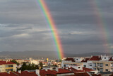 Double rainbow over buildings