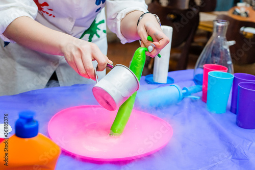 Liquid nitrogen freezes a balloon in a children's lab. A set of containers and tools for scientific experiments