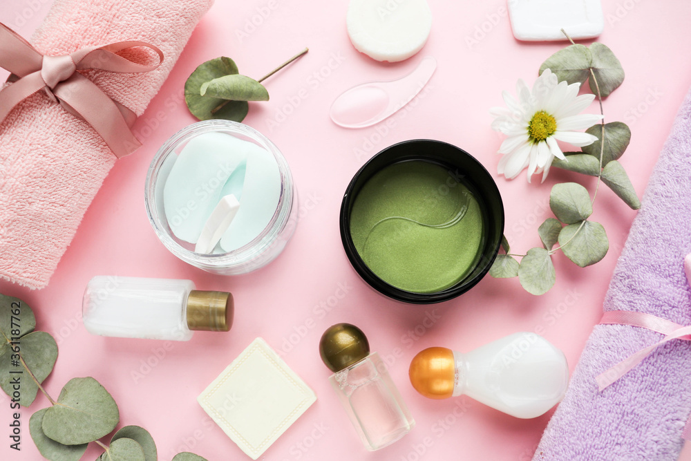 spa theme. face mask, set of towels, cosmetics and eucalyptus leaves spa theme. face mask, set of towels, cosmetics and eucalyptus leaves