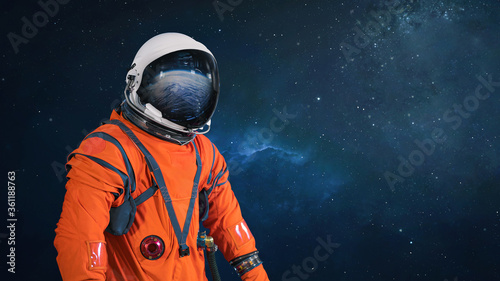 Fototapeta Naklejka Na Ścianę i Meble -  Astronaut in the outer space with stars and galaxies. Abstract wallpaper. Spaceman. Elements of this image furnished by NASA	

