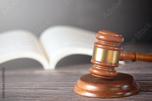Photography Old wood Judge hammer with law book on the table wood background, Used for adjudication and Justice