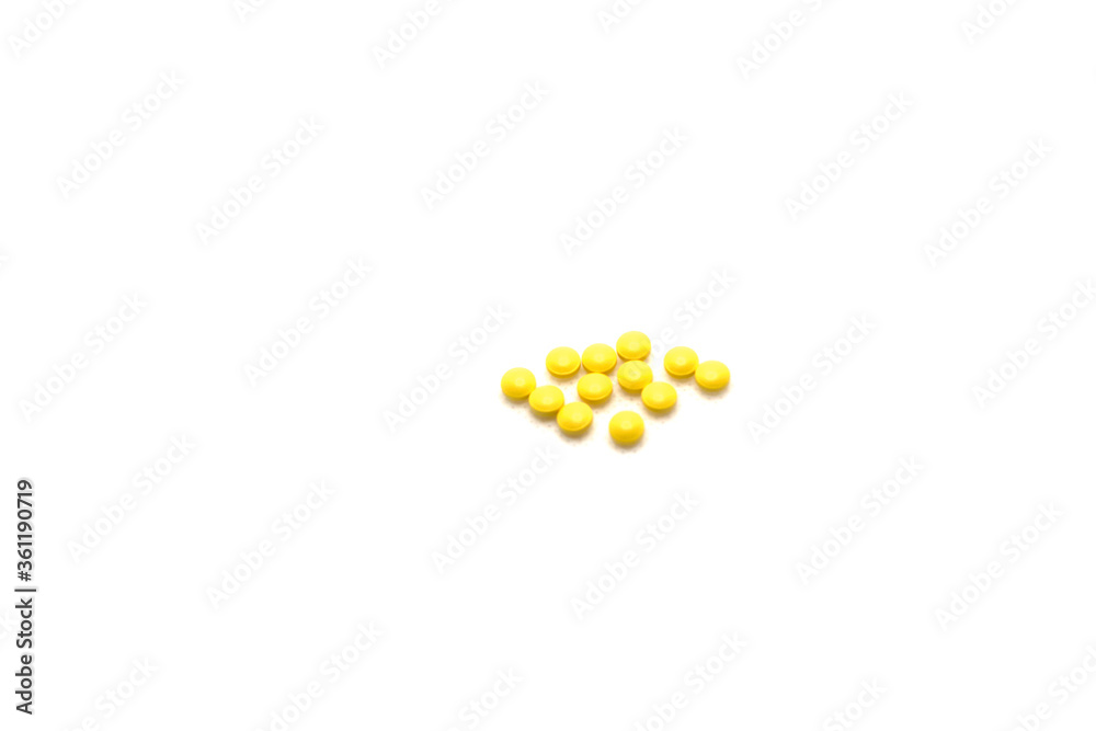 Yellow pills isolated on white background Yellow pills isolated on white background
