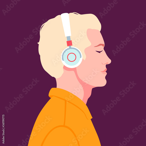 Young man listen to music on headphones. Music therapy.