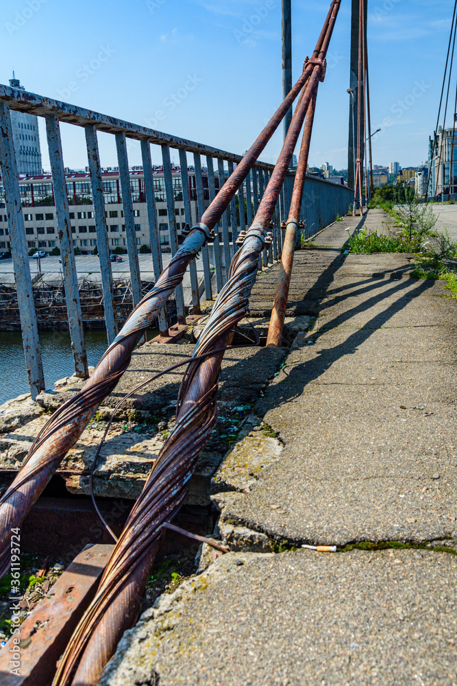 Old rusty steel rope of the bridge. Closeup Old rusty steel rope of the bridge. Closeup