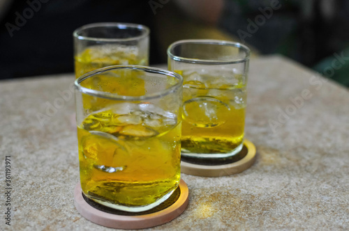 Cold fresh green iced tea in a bar in Saigon / Ho Chi Minh City. The weather is muggy warm, high humidity, the iced tea is refreshing at any time of the day.