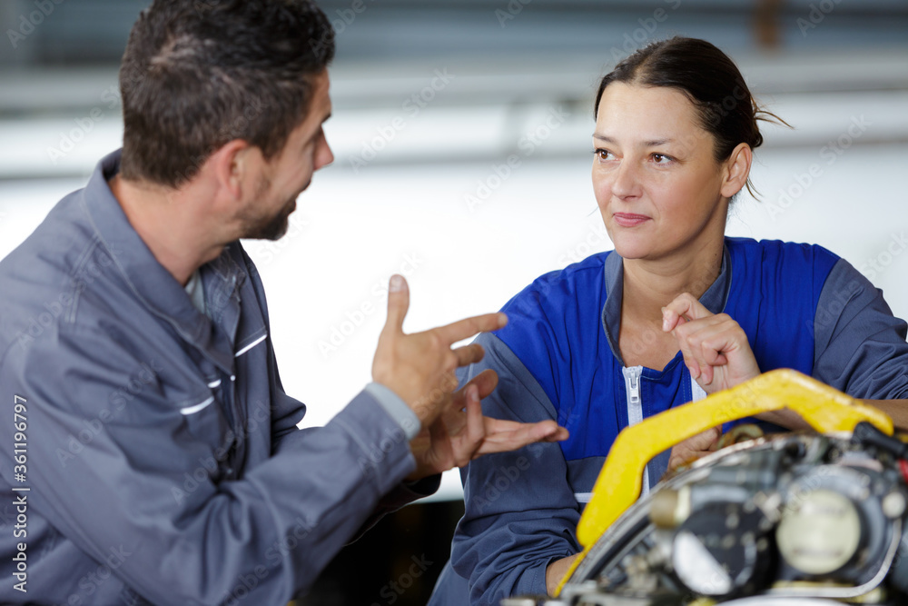 man and woman mechanics baffled work man and woman mechanics baffled work