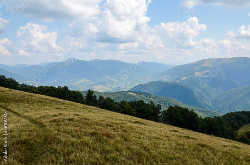 Beautiful landscape of summer mountains with mountain valley, blue sky and clouds. Carpathians Ukraine