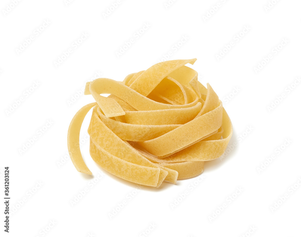 twisted pasta in a round fettuccine nest on a white isolated background twisted pasta in a round fettuccine nest on a white isolated background